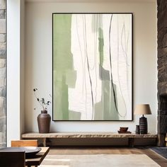 an abstract painting hangs on the wall above a bench in front of a stone fireplace