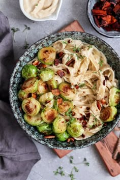 brussel sprouts and bacon are served in a bowl