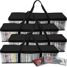 a large black bag filled with lots of dvd's next to a cd case