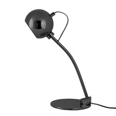 a black table lamp with a metal base and an electric cord attached to the arm