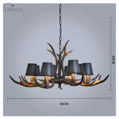 the antler chandelier is shown with four lamps on each side and one light hanging