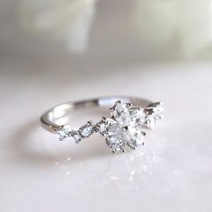 a diamond ring sitting on top of a table