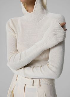 Color: White Lightweight knitted fabric Slim fit High neck Attached hood Long sleeves Slip on style Unlined 60% Acrylic 20% Cotton 20% Polyester Dry Clean By The Frankie Shop. Imported Sports Wear Women, Denim Suit, The Frankie Shop, Frankie Shop, Ski Fashion, Paris Woman, Knit Hoodie, Clothes Shop, Limited Stock