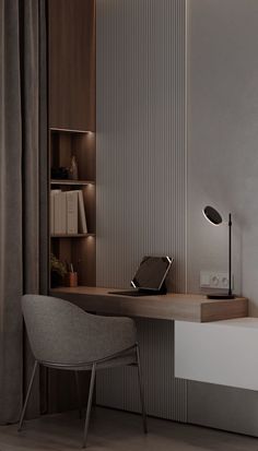 a desk with a chair, lamp and bookshelf in the corner next to it