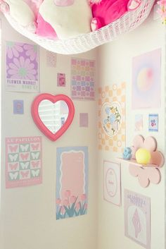 a room with pink and white decorations on the walls