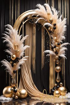 a black and gold party decoration with white feathers, balls, and streamers in front of a backdrop