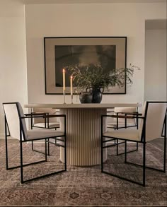 a dining room table with chairs around it