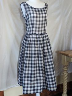 This sleeveless cotton gauze day dress is a staple for any vintage fashionista! Unlined, semi sheer fabric, can be worn with or without a slip, depending on your inclination, fitted bodice, defined waist, gathered skirt, side zipper closure.  There are no flaws aside from a few very faint rust colored spots on the skirt, I only noticed them when I ironed the dress. See pictures.  Measurements taken flat: Waist: 14 ½" Bust: 18½" Hips: Free Shoulder to waist: 16" Skirt length: 26" Cotton Gauze Dress, Defined Waist, Gauze Dress, Gathered Skirt, Sheer Fabric, Semi Transparent, Rust Color, Day Dress, Vintage Cotton