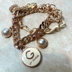 New Without Tags. 7” Adjustable. By Guess. G Initial, Guess Boots, Guess Jewelry, Guess Wallet, Guess Heels, Bow Bracelet, Purple Bows, Gold Medallion, Glitter Sneakers