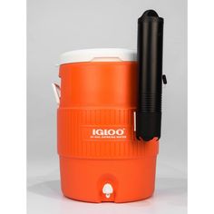 an orange and white cooler with a black handle on the top is sitting in front of a gray background