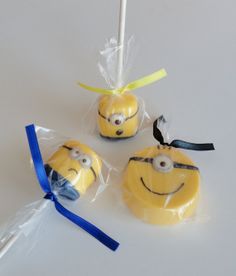 three minion lollipops wrapped in cellophane