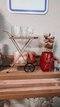 a shelf with glasses and other items on it