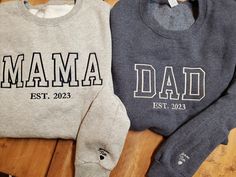 "Get one of these trending Mom Dad Est date crew neck sweatshirts with or without kids names on sleeves These are fast becoming the newest style for moms and dads this year Choose your shirt color and thread color.  Pictures shown for both.  If you prefer the ultra trendy \"tonal\" look, put that for your thread option and we have those colors already picked out to best match the shirt color 50/50 mid weight sweatshirt perfect for layering and fall nights Some items maybe substituted if they bec Mom And Dad Sweaters, Custom Mom Gifts, Family Matching Sweatshirt For Fall, Family Matching Fall Sweatshirt, Family Matching Crew Neck Sweatshirt For Father's Day, Father's Day Casual Sweatshirt With Name Print, Casual Family Winter Sweatshirt, Casual Winter Sweatshirt For Family Occasions, Customizable Long Sleeve Sweatshirt For Father's Day