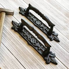 an old pair of door handles on a wooden floor