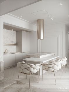 a large white table surrounded by chairs in a room