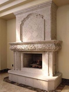 an ornate fireplace in the middle of a room