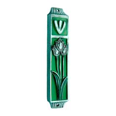 a green and white vase with flowers on the front, in an art deco style