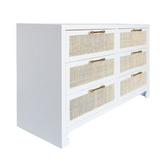 a white dresser with wicker drawers and gold handles on the bottom, against a white background