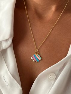 🌈 Wear the joy with our Colorful Cloud Necklace - a lively and vibrant accessory that adds a burst of color to your style. Get this cute jewelry made with the high quality elements✨ You can go with 925K Sterling Silver with the options of Gold, Rose Gold or White Gold finish Beautiful jewelry for everyone 💙 Details * 925K Sterling Silver → 14K Gold, Rose Gold or White Gold plated * Chain length is approximately 18 inches (16+2 in extender) / 45 cm (40+5 cm extender) * Time is important! You will receive your package as soon as possible 🚚 * We care about the quality of metal to make sure it will last for a long time * We use enamel technique to color the jewelry and high quality zircons only * There can be tiny differences on each item, length difference of the chain as well as color cha Rainbow Chain Necklace For Gift, Cloud Pendant, Playful Rainbow Charm Necklace For Gift, Cloud Necklace Gold, Rain Cloud Jewelry, Rainbow Cloud, Minimalist Gifts, Gold Plated Chains, Cute Jewelry