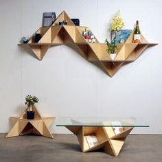 three different views of a table with shelves on each side and an upside down shelf in the middle