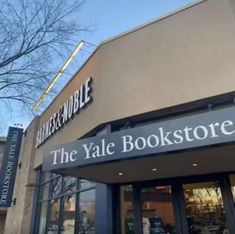 the store front of a bookstore with large windows