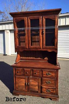 an old wooden hutch with glass doors and drawers on the bottom, before and after restoration