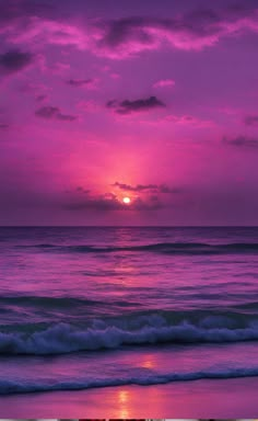 the sun is setting over the ocean with purple clouds