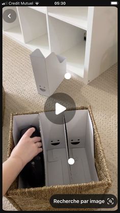 someone is opening the box with their hand to see what's inside it and how they are doing something