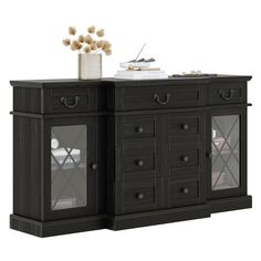 a black cabinet with glass doors and drawers