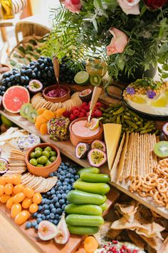 an assortment of fruits and crackers on a table