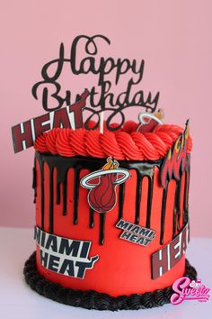 a miami heat birthday cake is decorated with red icing and black lettering that says happy birthday