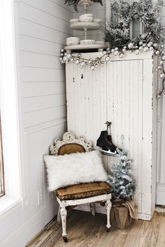 an old door is decorated for christmas with ornaments and decorations on it, along with a bench