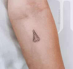 a person with a small tattoo on their arm