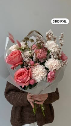 a woman holding a bouquet of pink and white flowers in her hands with the caption 300 pyb