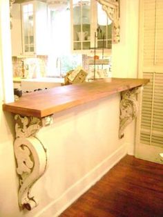 an image of a counter top in the middle of a room with wood flooring