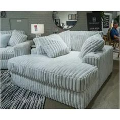 a couch and chair are on display in a store