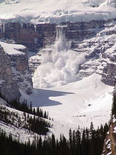 an image of a mountain landscape with snow and steam coming out of the mountainside