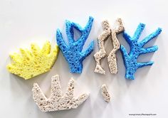 three different types of sponge art displayed on a white surface, one yellow and one blue