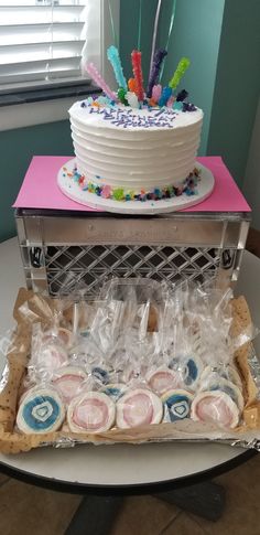 a cake and some cookies on a table