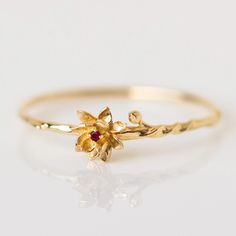 These unique solid gold birth month flower rings feature delicate and detailed flowers set with each month's birthstone. Discover this new take on personalized birth month jewelry. Rings With Birthstones, July Water Lily, August Poppy, January Carnation, Lily Ring, Affordable Fine Jewelry, Flower Rings, Gold Flower Ring, Local Eclectic