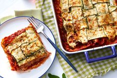 two plates with lasagna casserole next to each other on a table