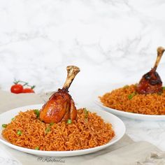 two white plates filled with rice and meat