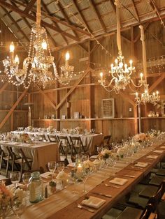 the tables are set up with place settings and centerpieces for an elegant wedding