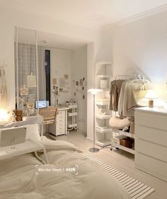 a bedroom with white furniture and lots of clutter