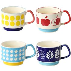 four different colored cups with apple designs on them