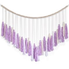 purple and white tasselled garland hanging from string