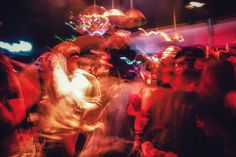 blurry photograph of people dancing at a party