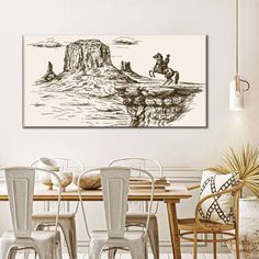 a dining room table with chairs and a painting on the wall above it that has an image of two horses