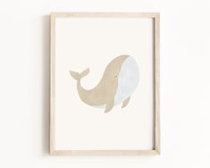 a framed print with a whale on it's face in beige and white colors