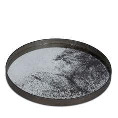 a round metal tray filled with white powder